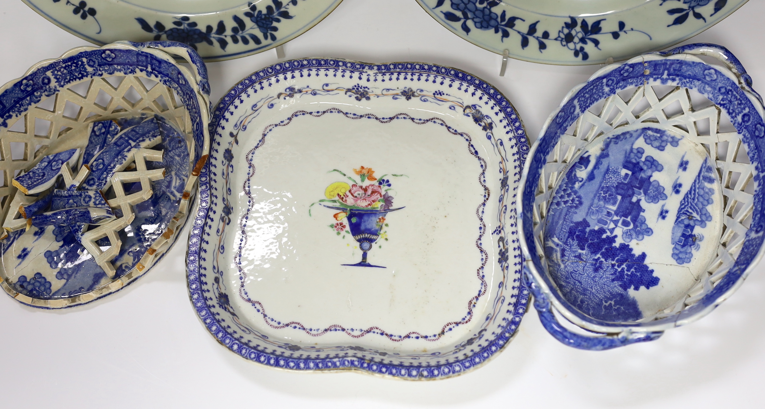 A Chinese porcelain serving dish and a pair of plates, and a pair English blue and white chestnut baskets, largest 23cm diameter (a.f.)